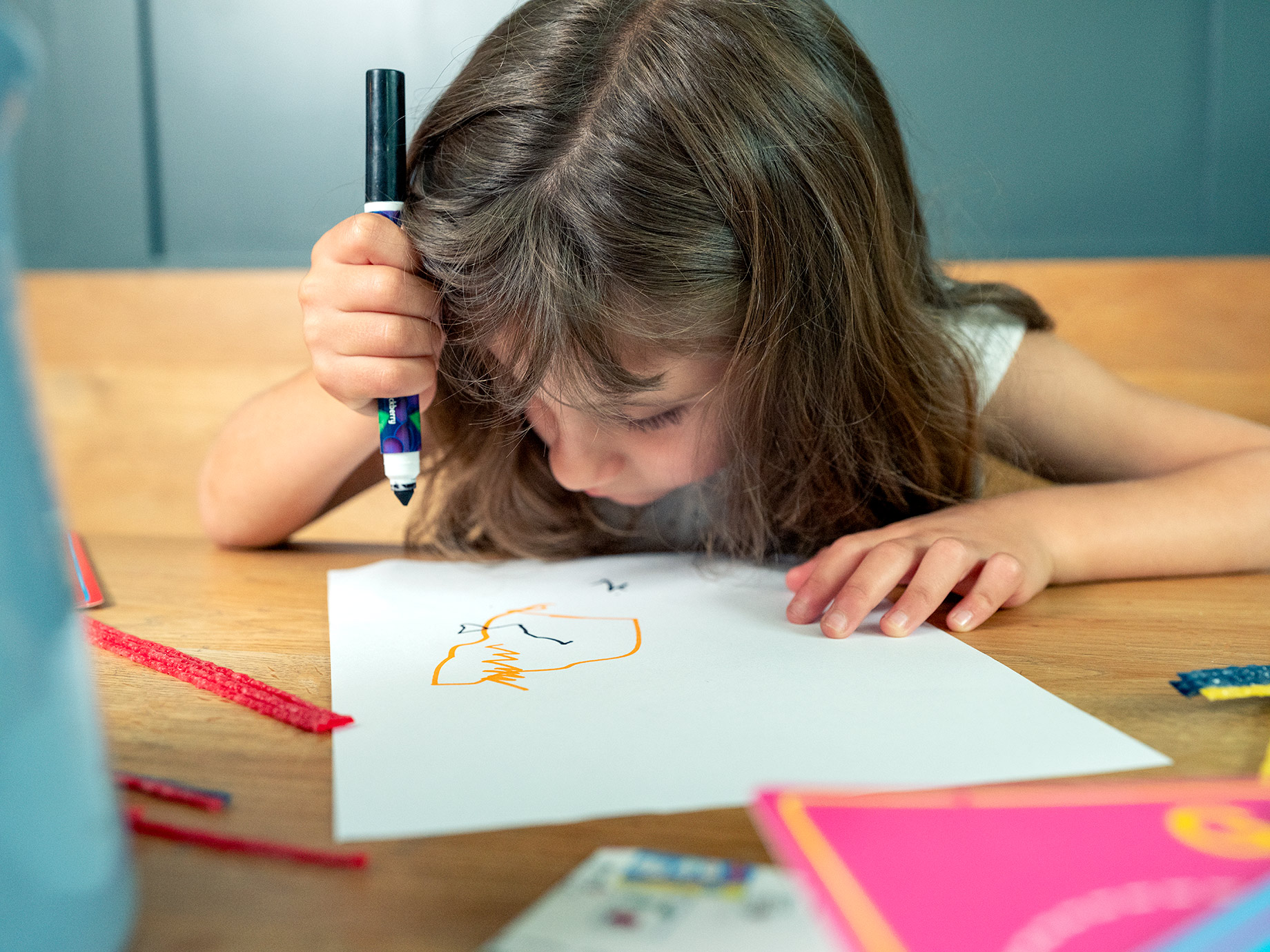 Young girl drawing Good Boy Wolf Photographer, filmic portrait