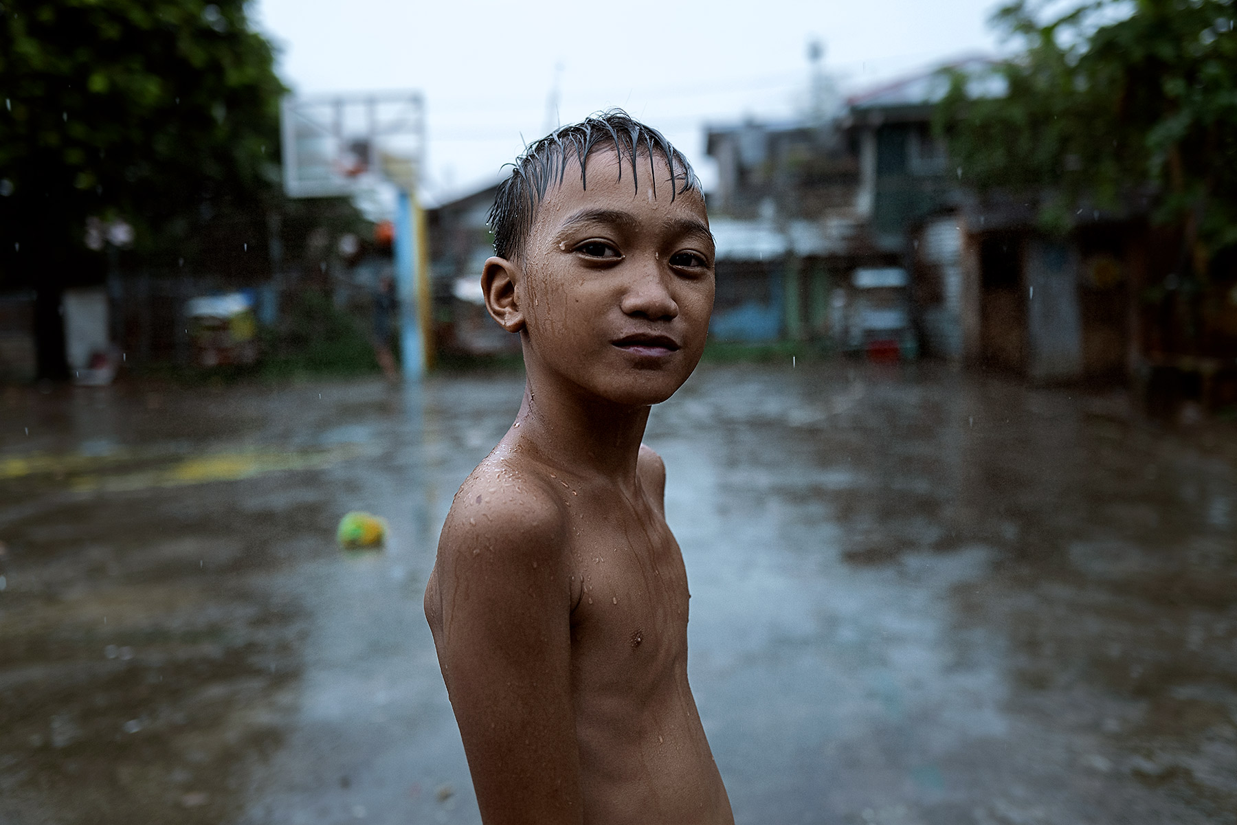 Good Boy Wolf Photographer, Philippines, Basket ball child, stood outside in the rain 