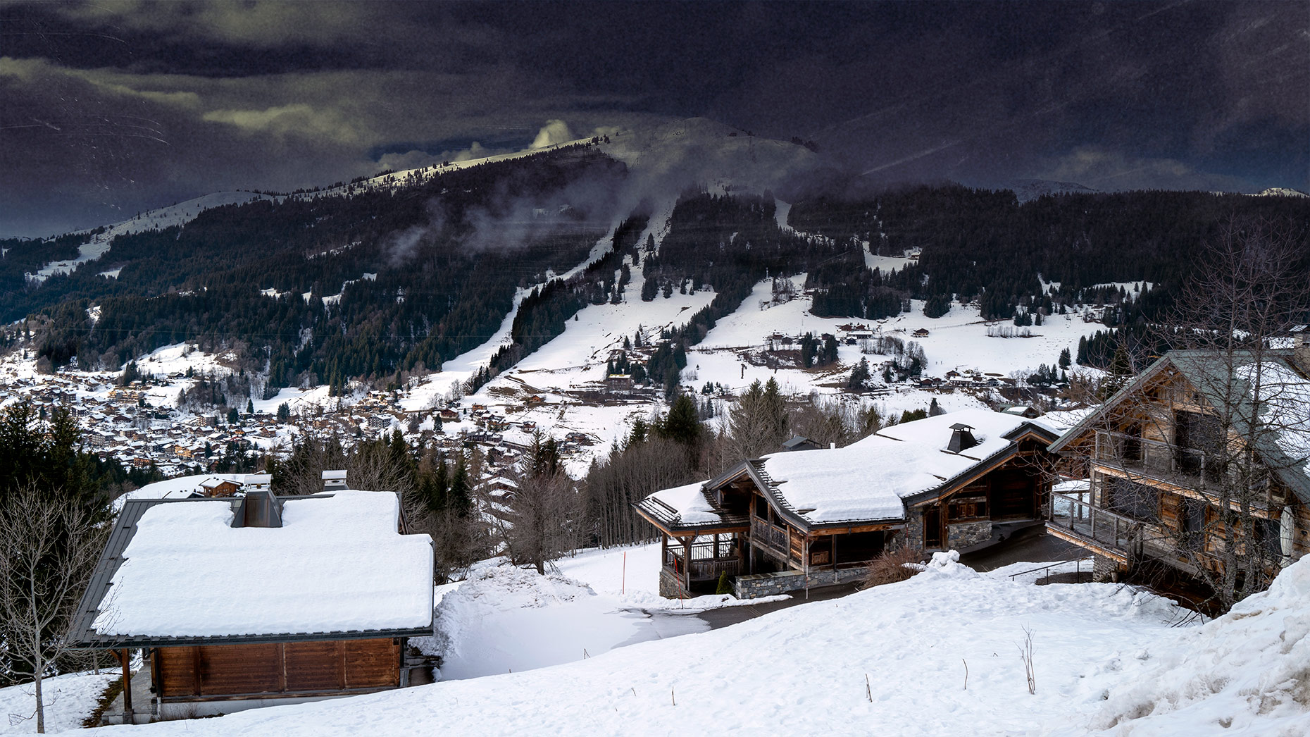Good Boy Wolf Photographer, filmic portrait, letgets mountain resort, heavy snow on the buildings 